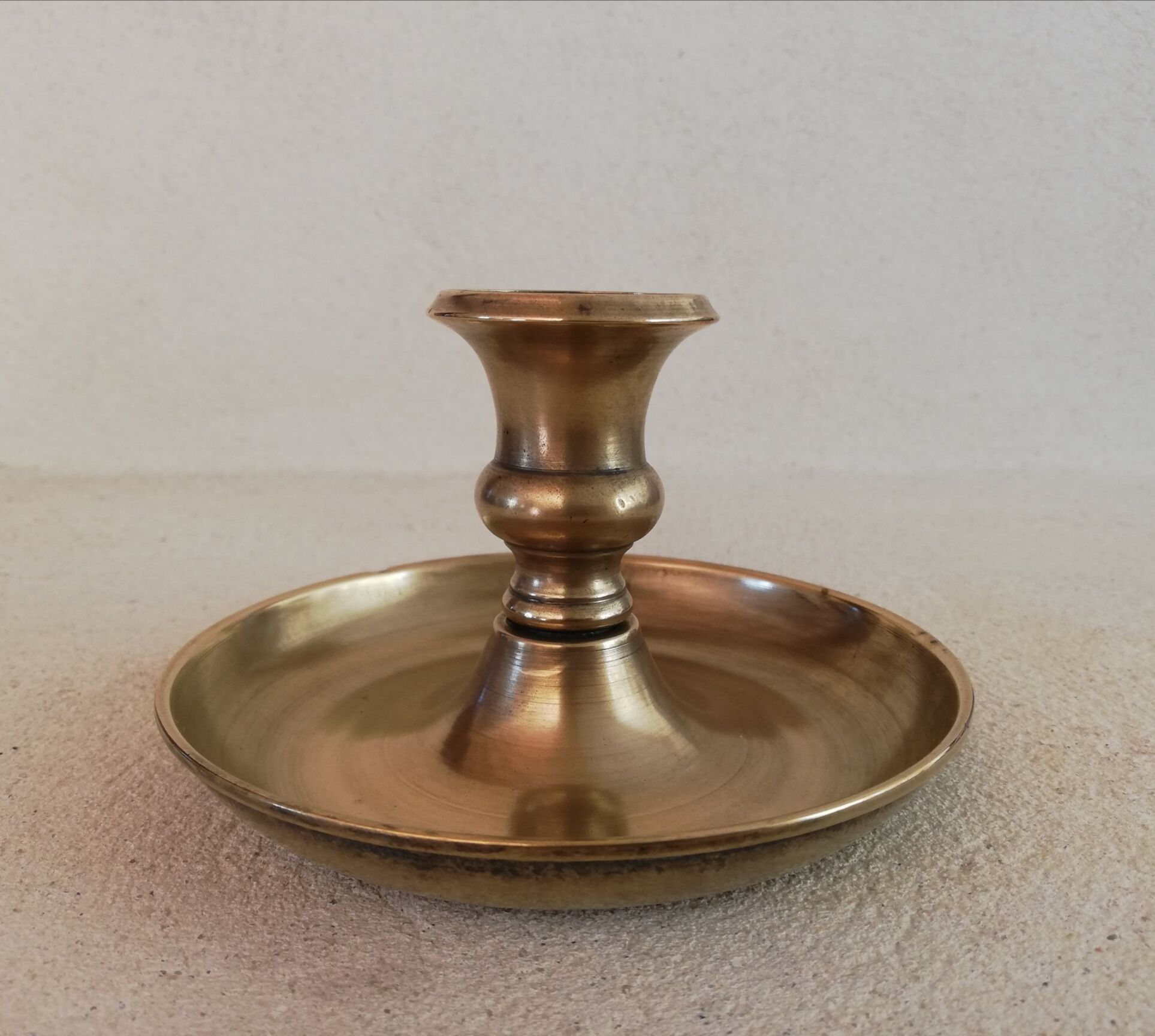 Brass hand candle holder