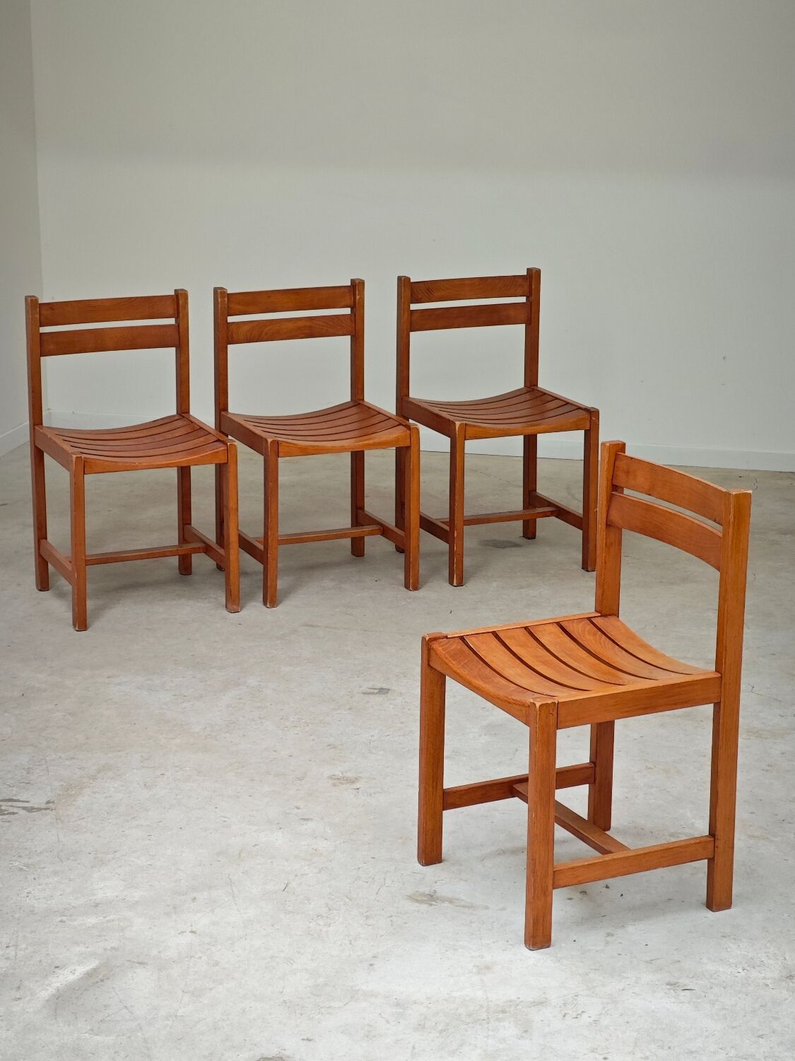 Set of 4 wooden chairs by André Sornay