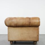 Chesterfield armchair made of cowhide leather in a light cognac colour