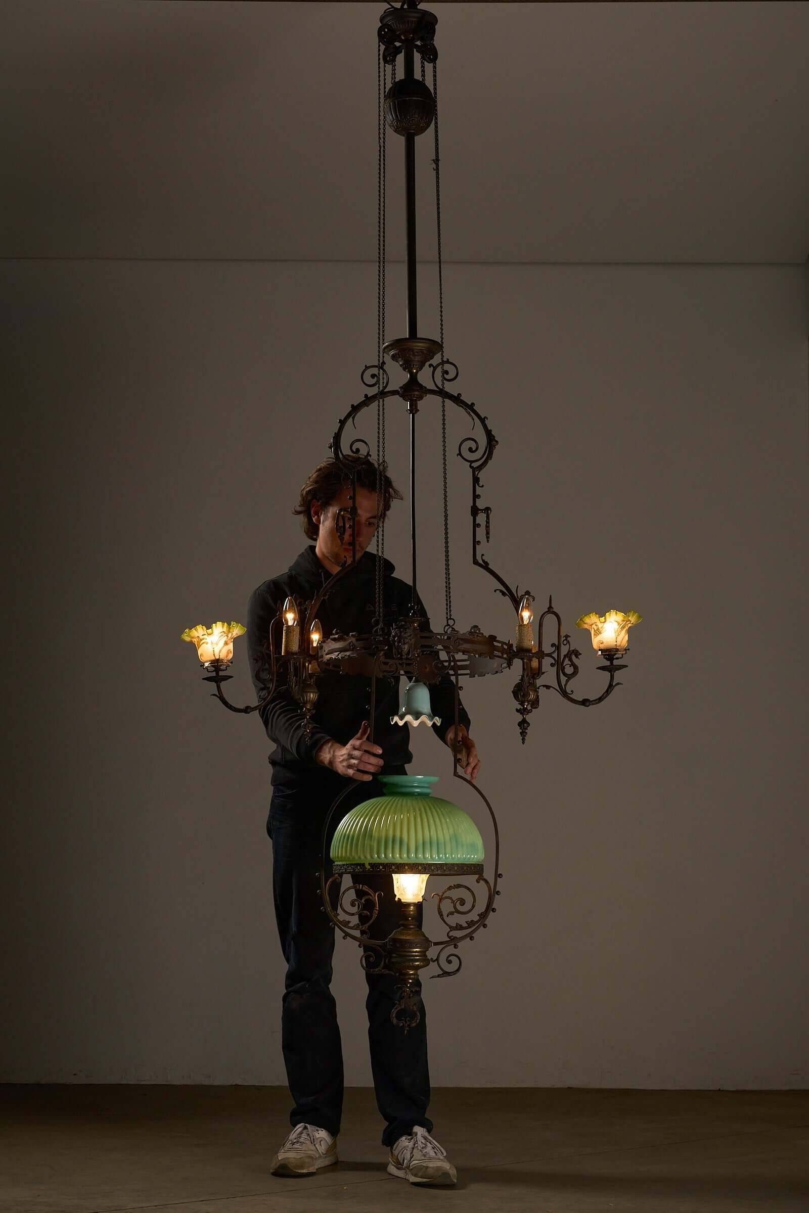 Antique adjustable height chandelier with original glasswork and brass detailing