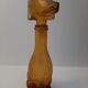 Amber glass bottle representing a dog, Empoli Italy 60s