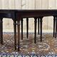 English nesting tables in mahogany and leather top under glass - work from the 1950s