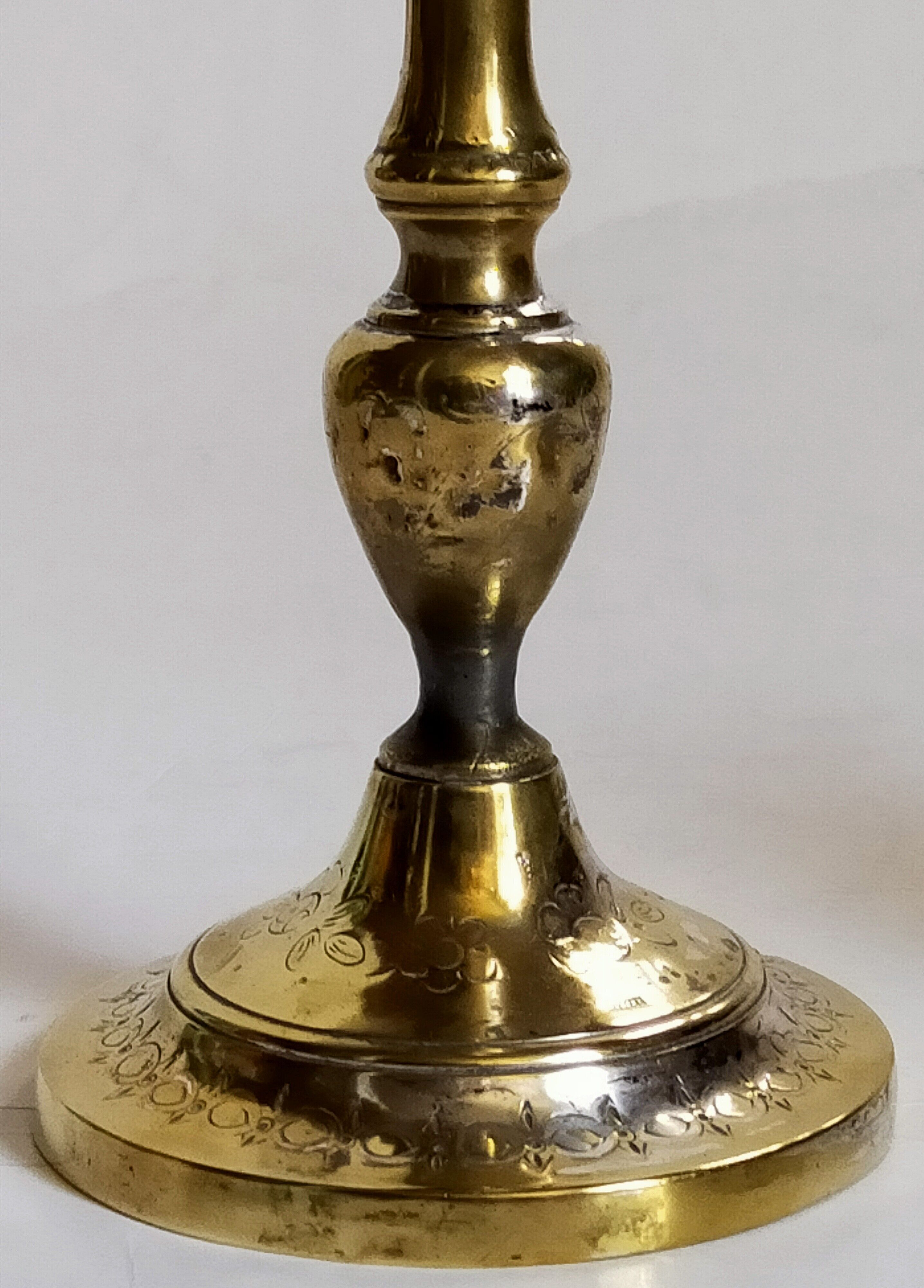 Duo of solid brass and gold metal candle holders worked old