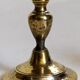 Duo of solid brass and gold metal candle holders worked old