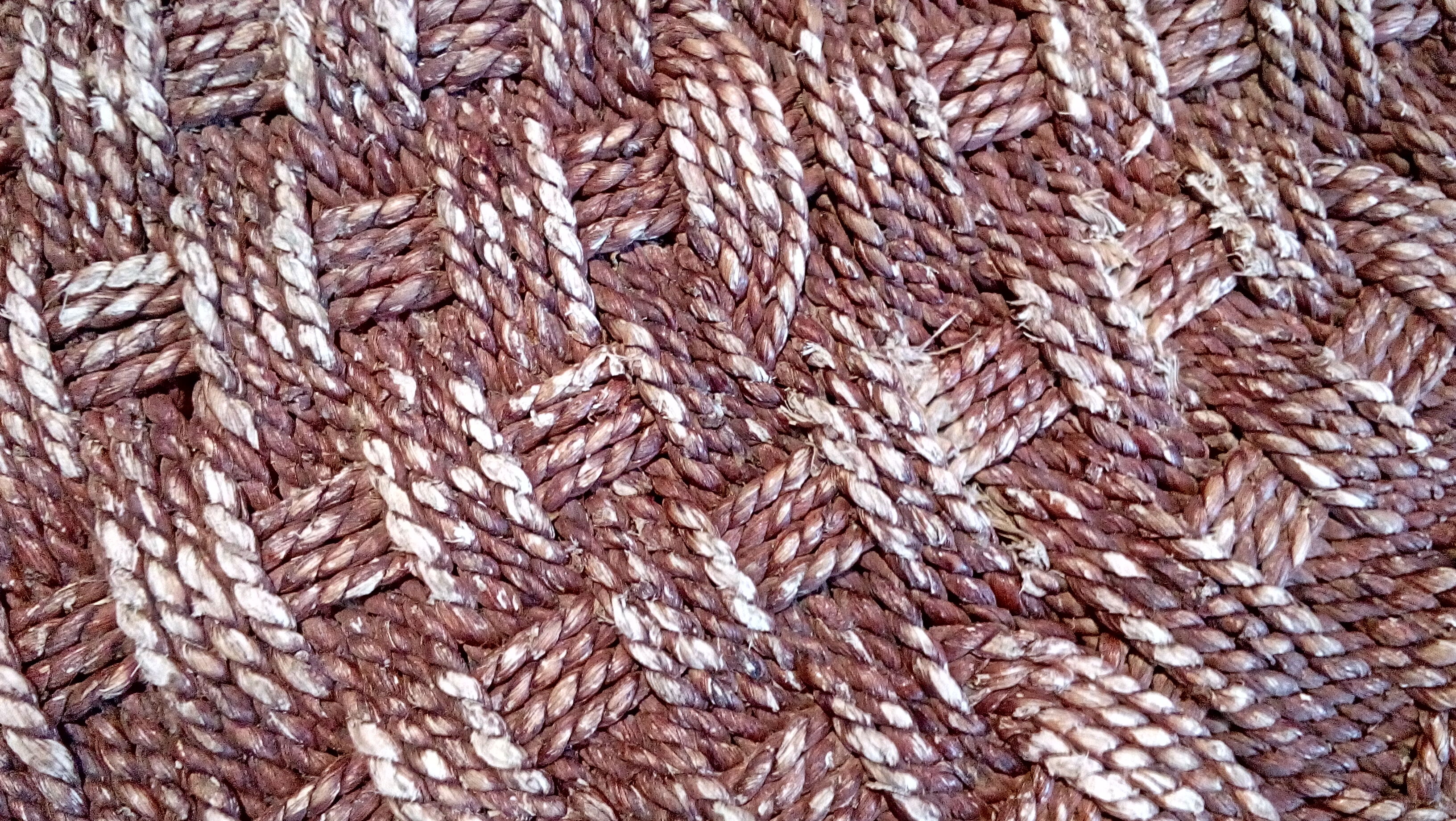 Coffee table in woven rope and rattan