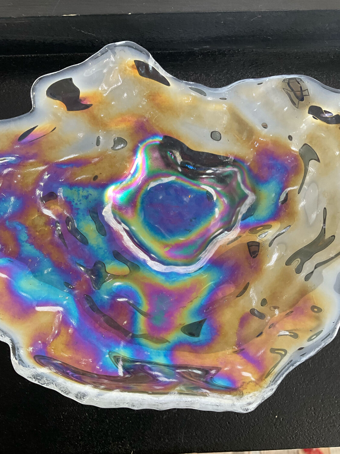 Empty vintage pocket in iridescent glass