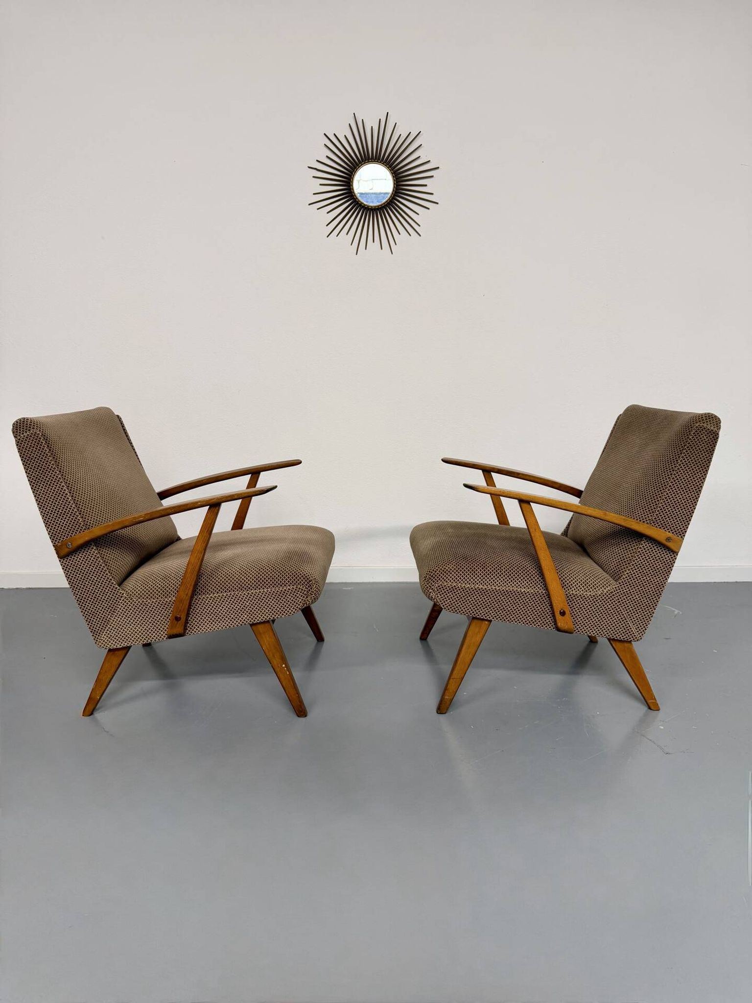 Set of 2 vintage wooden and fabric armchairs designed in the 1960s.