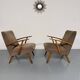 Set of 2 vintage wooden and fabric armchairs designed in the 1960s.
