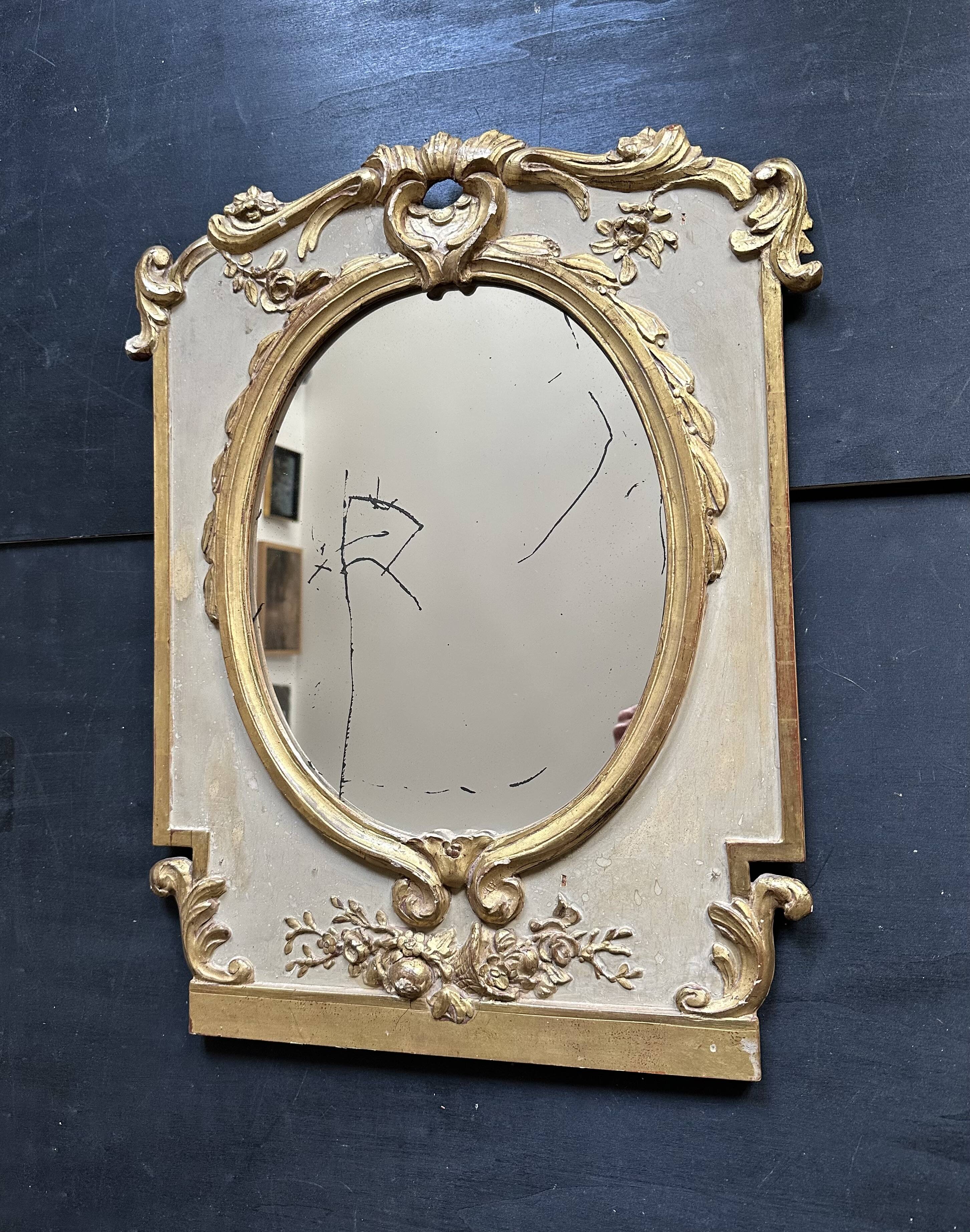 Napoleon III mirror in carved gilded wood, oval mercury glass.