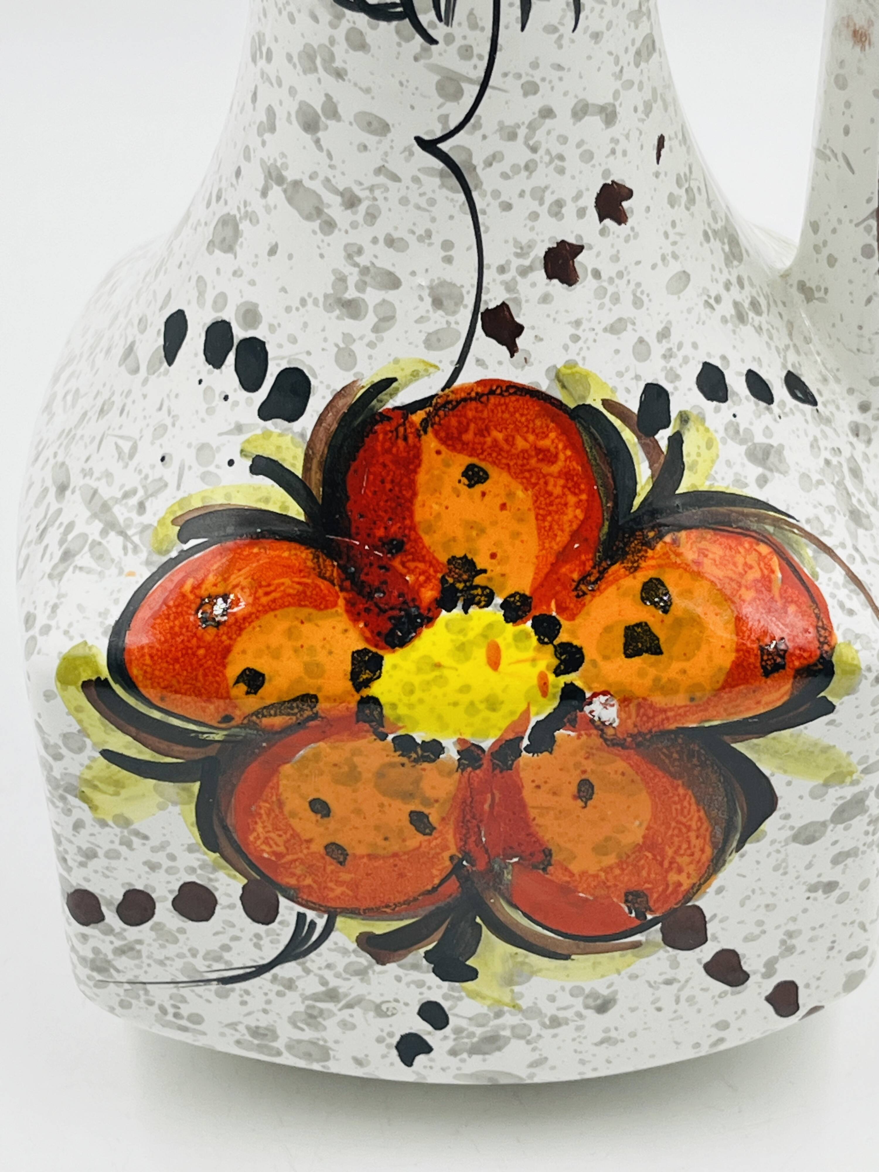 Vintage Italian vase in the shape of a carafe with floral decoration from the 1970s.