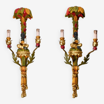 Pair of polychrome carved wooden sconces from the early 20th century