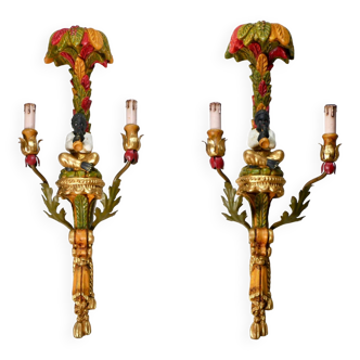 Pair of polychrome carved wooden sconces from the early 20th century