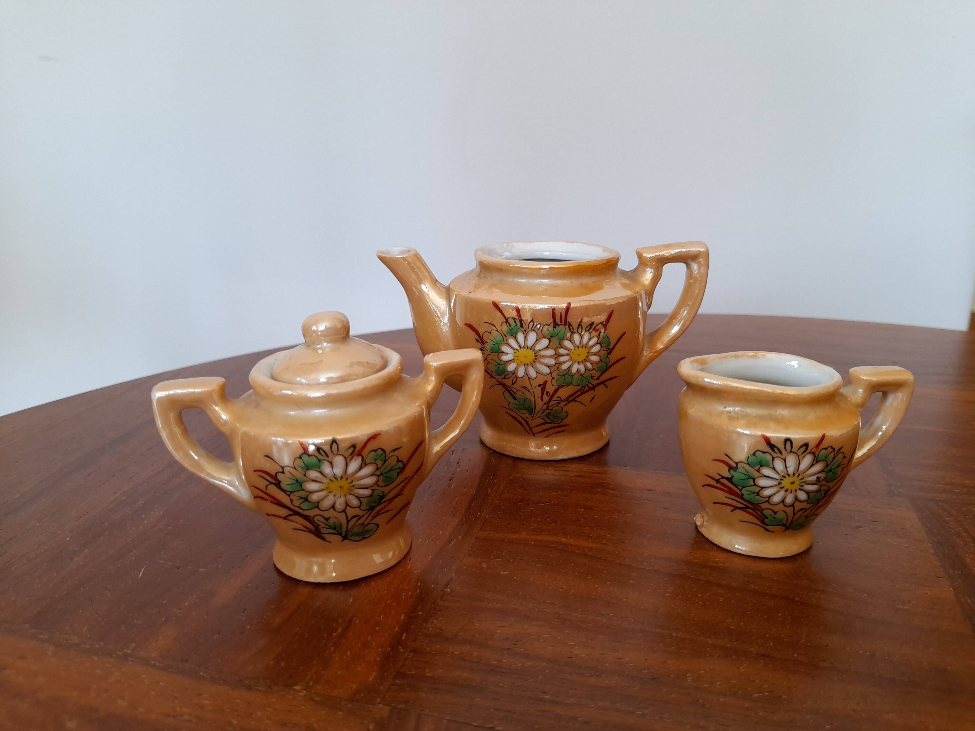 Miniature porcelain tea service with painted flowers - play food