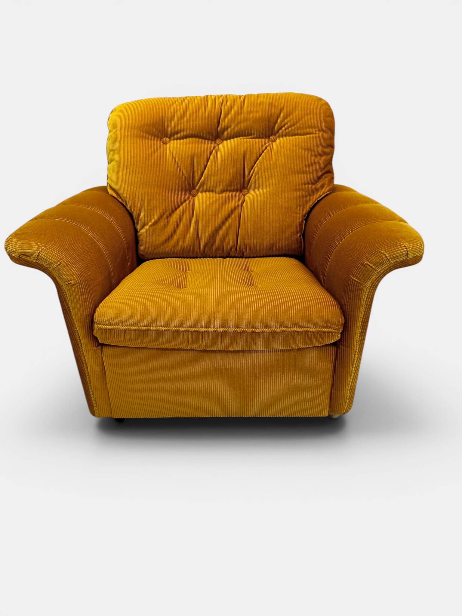 Vintage lounge chair on wheels in golden mustard corduroy 70s