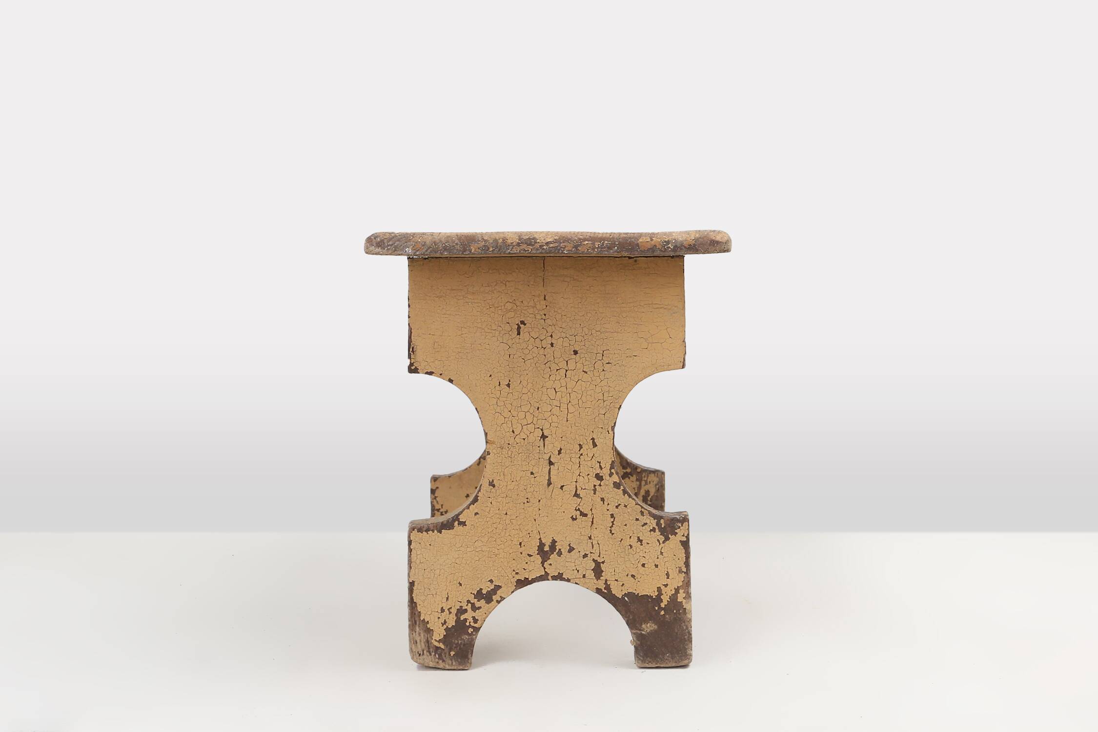 Beautiful shaped rustig low stool in painted wood, France ca. 1900