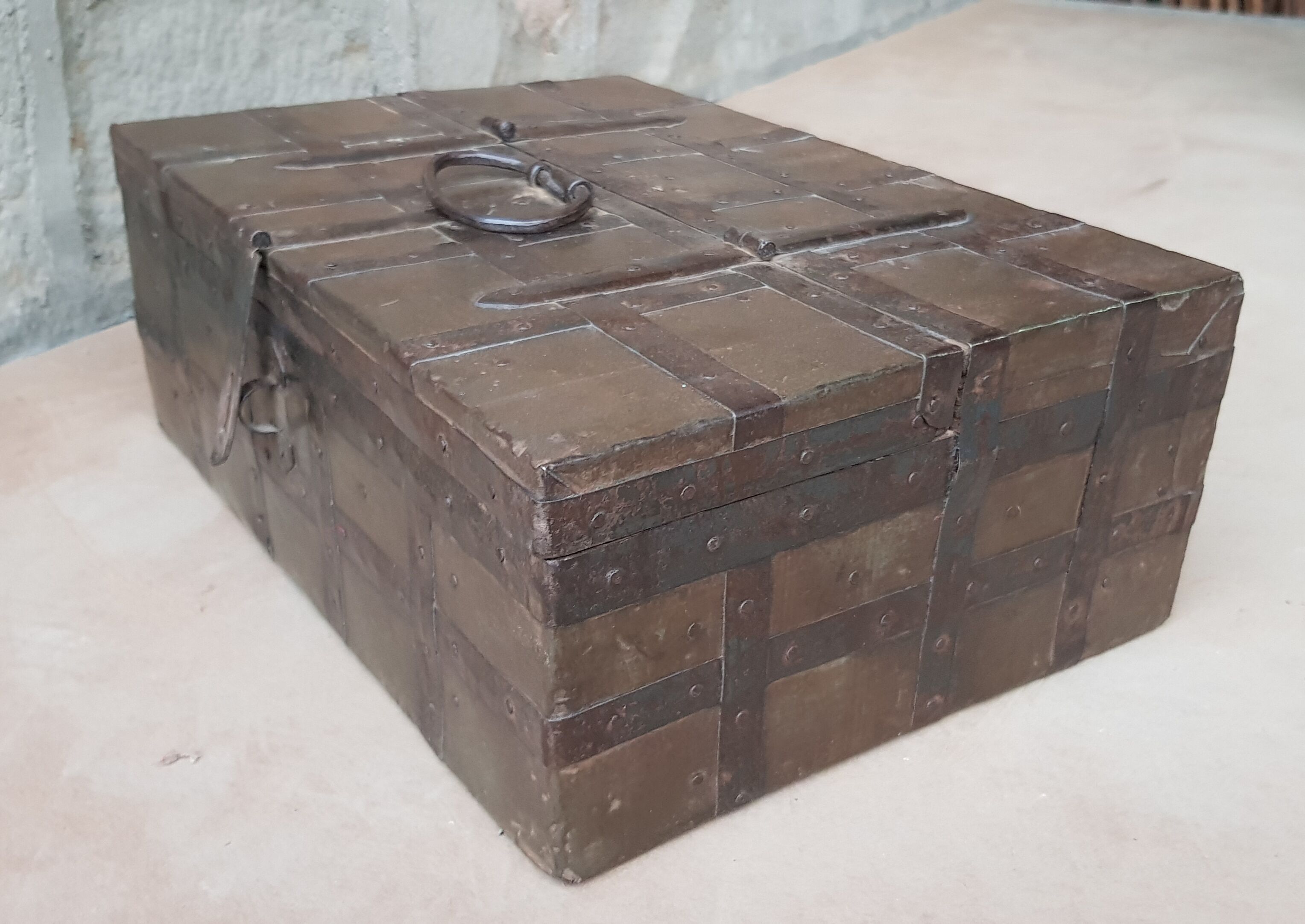 Old tribal chest in hammered metal