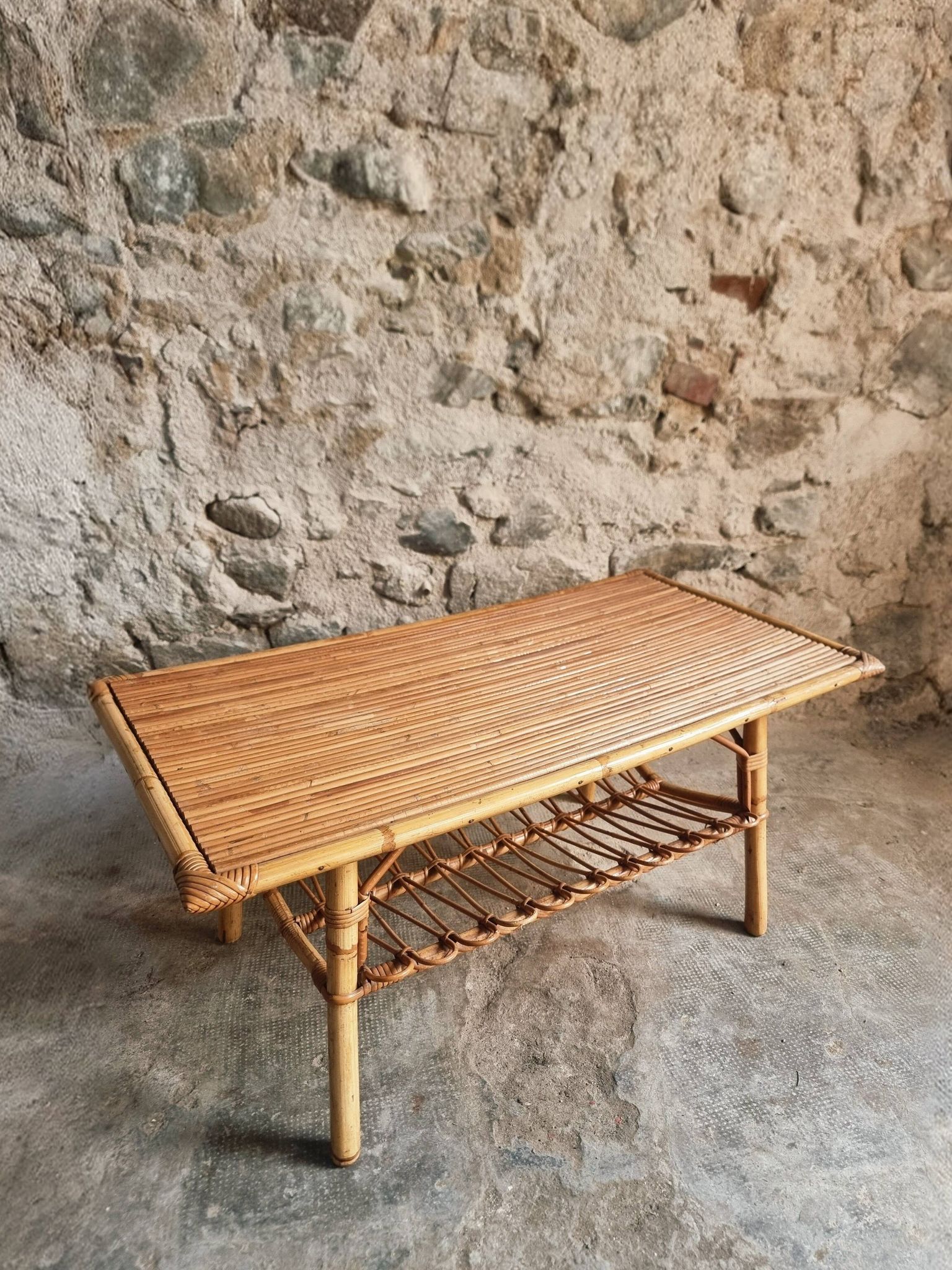 Vintage bamboo and rattan coffee table with magazine rack, French, circa 1960–1970.
