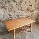 Vintage bamboo and rattan coffee table with magazine rack, French, circa 1960–1970.