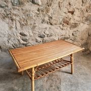 Vintage bamboo and rattan coffee table with magazine rack, French, circa 1960–1970.