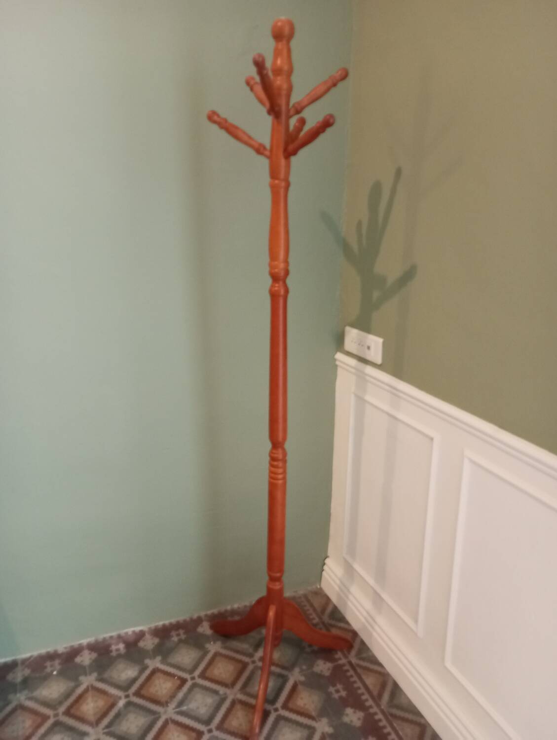 Wooden coat rack on stand