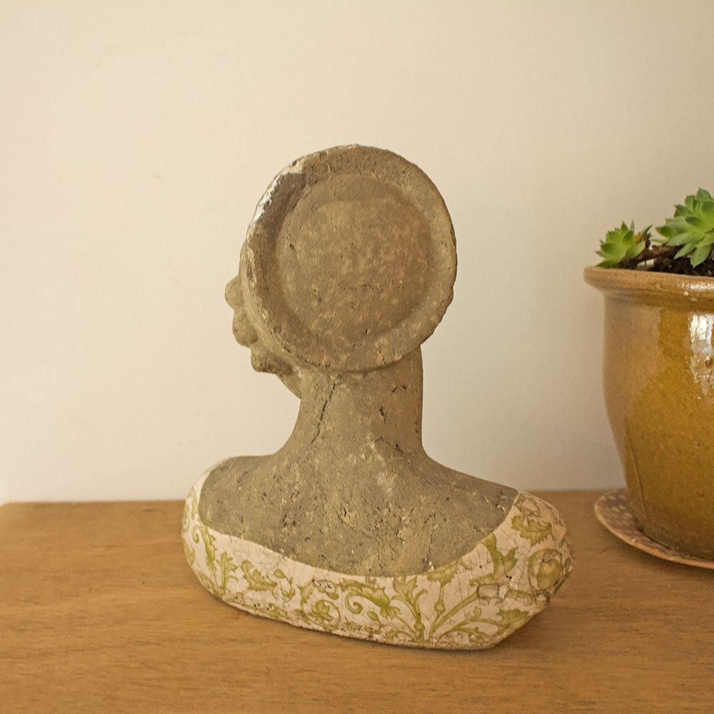 Woman bust in stone and enamel