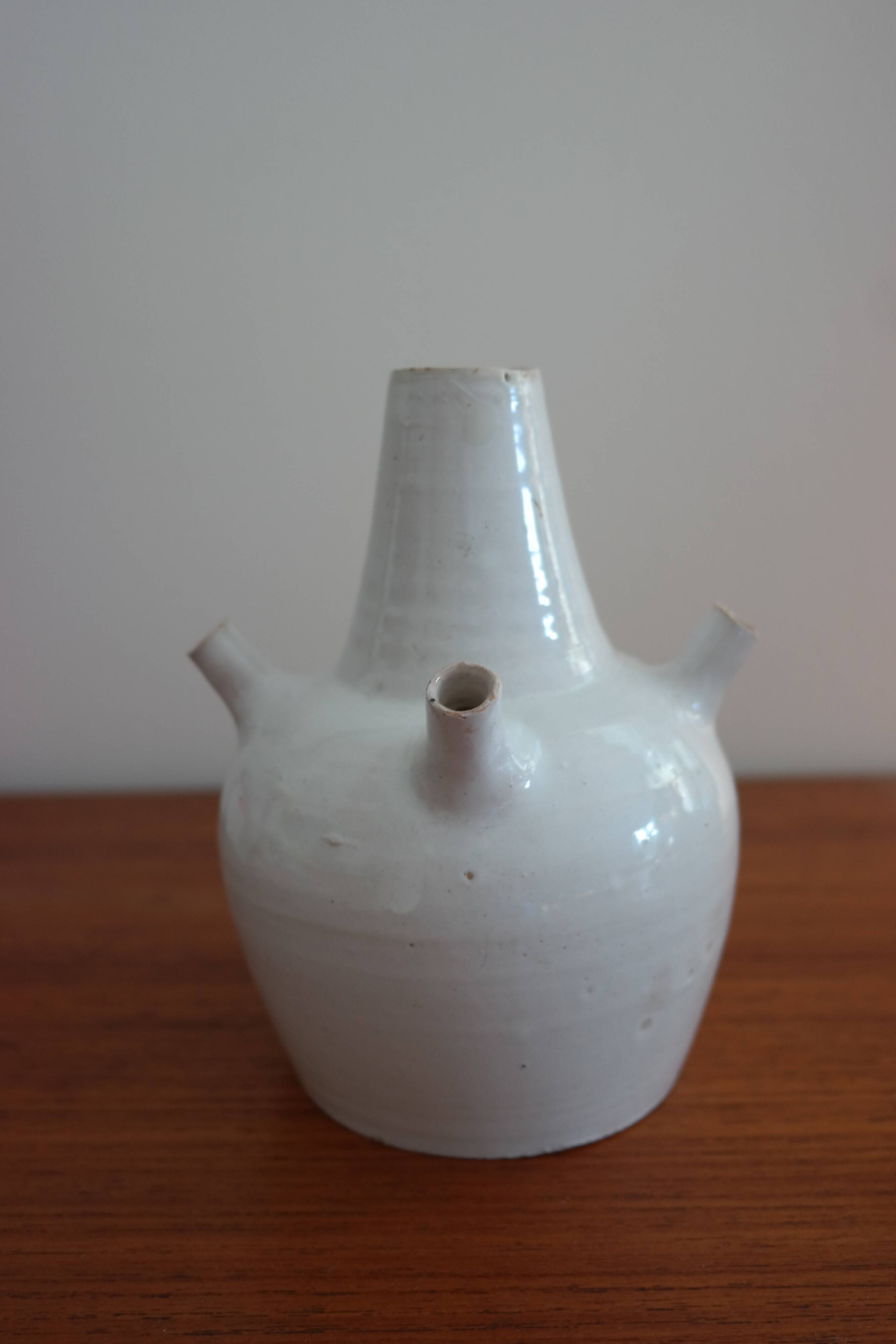 White enamelled earthenware flower vase signed HR