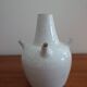 White enamelled earthenware flower vase signed HR