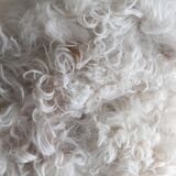 Danish mid-century tripod stool in beech, reupholstered in lambswool, 1960s.