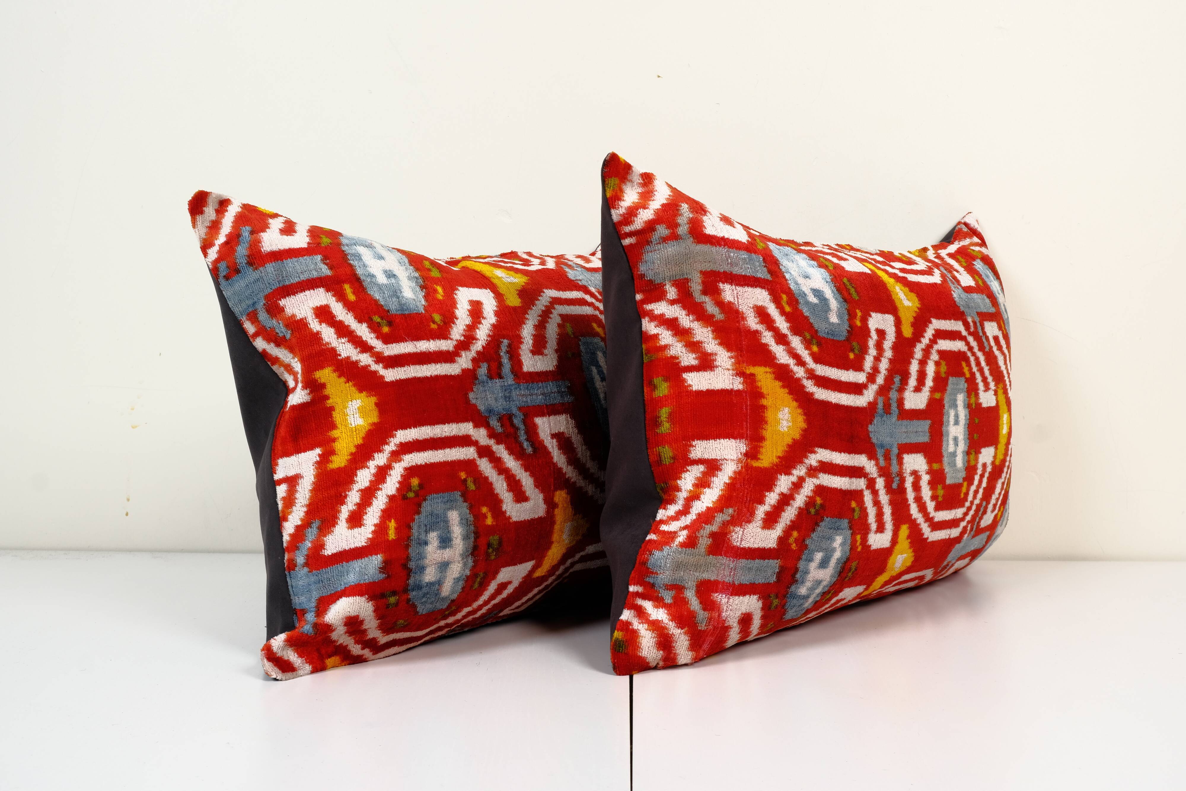 Set of two red ikat velvet lumbar pillows