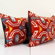Set of two red ikat velvet lumbar pillows