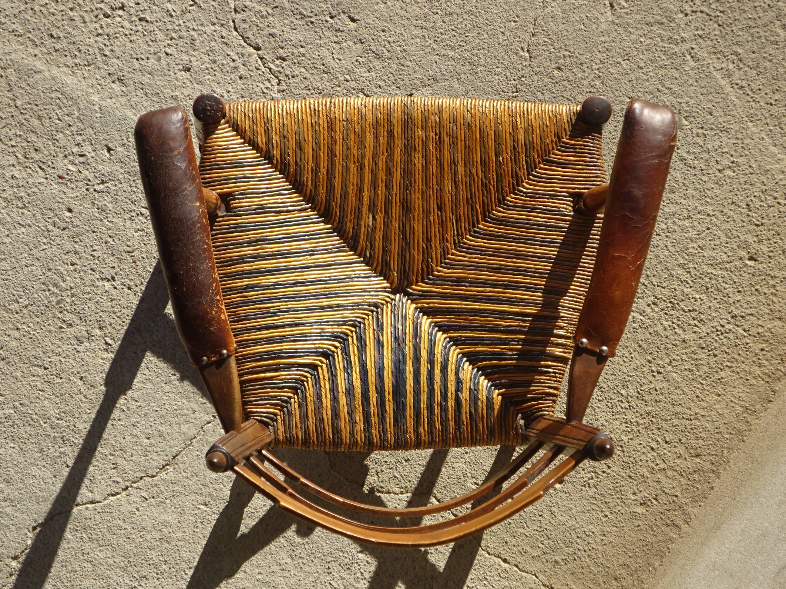 old armchair with leather armrests, from the 19th century