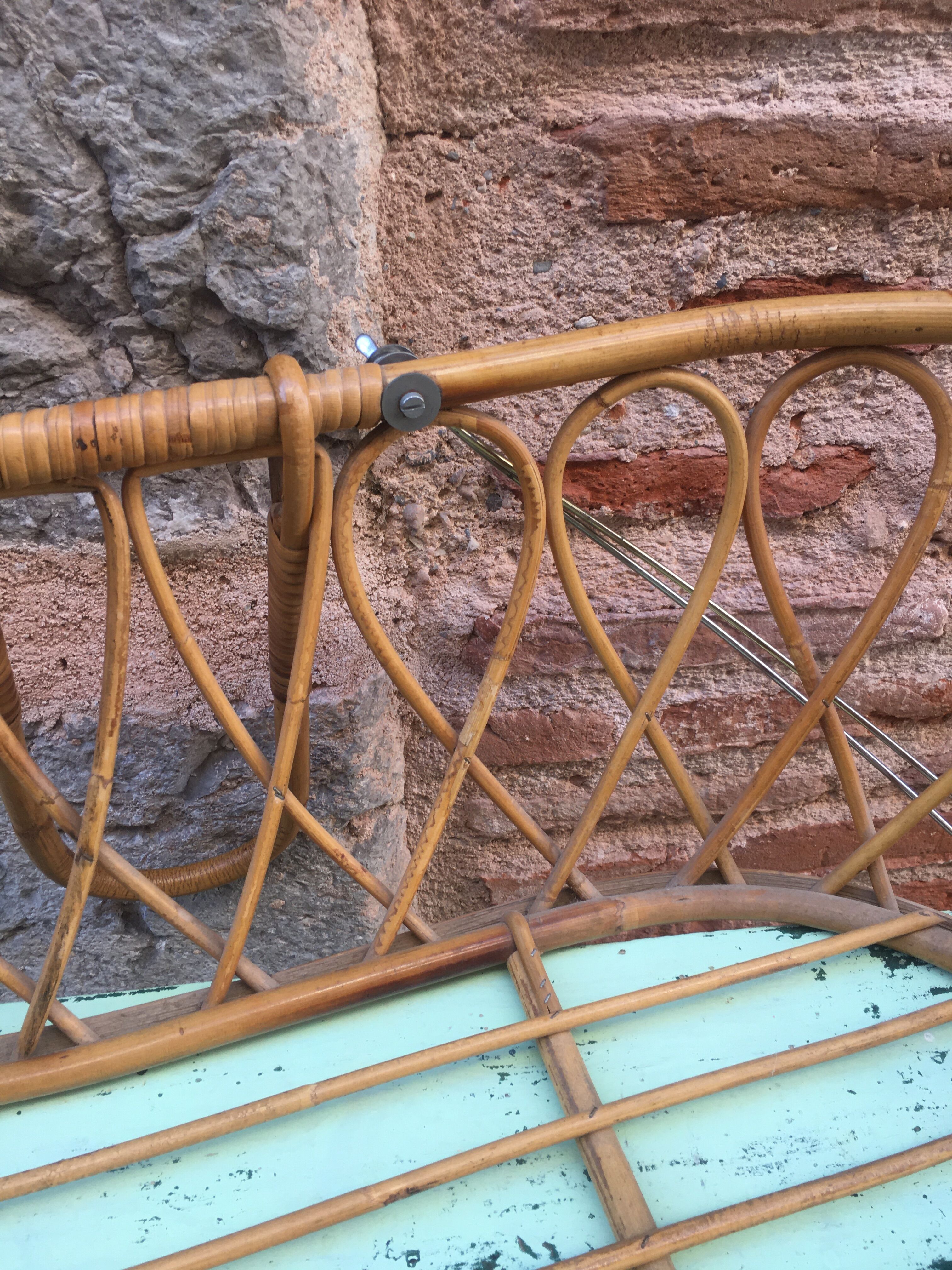 Rattan bassinet with hood arches