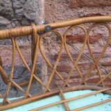 Rattan bassinet with hood arches