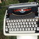 Baby hermes typewriter with manual job and his bag