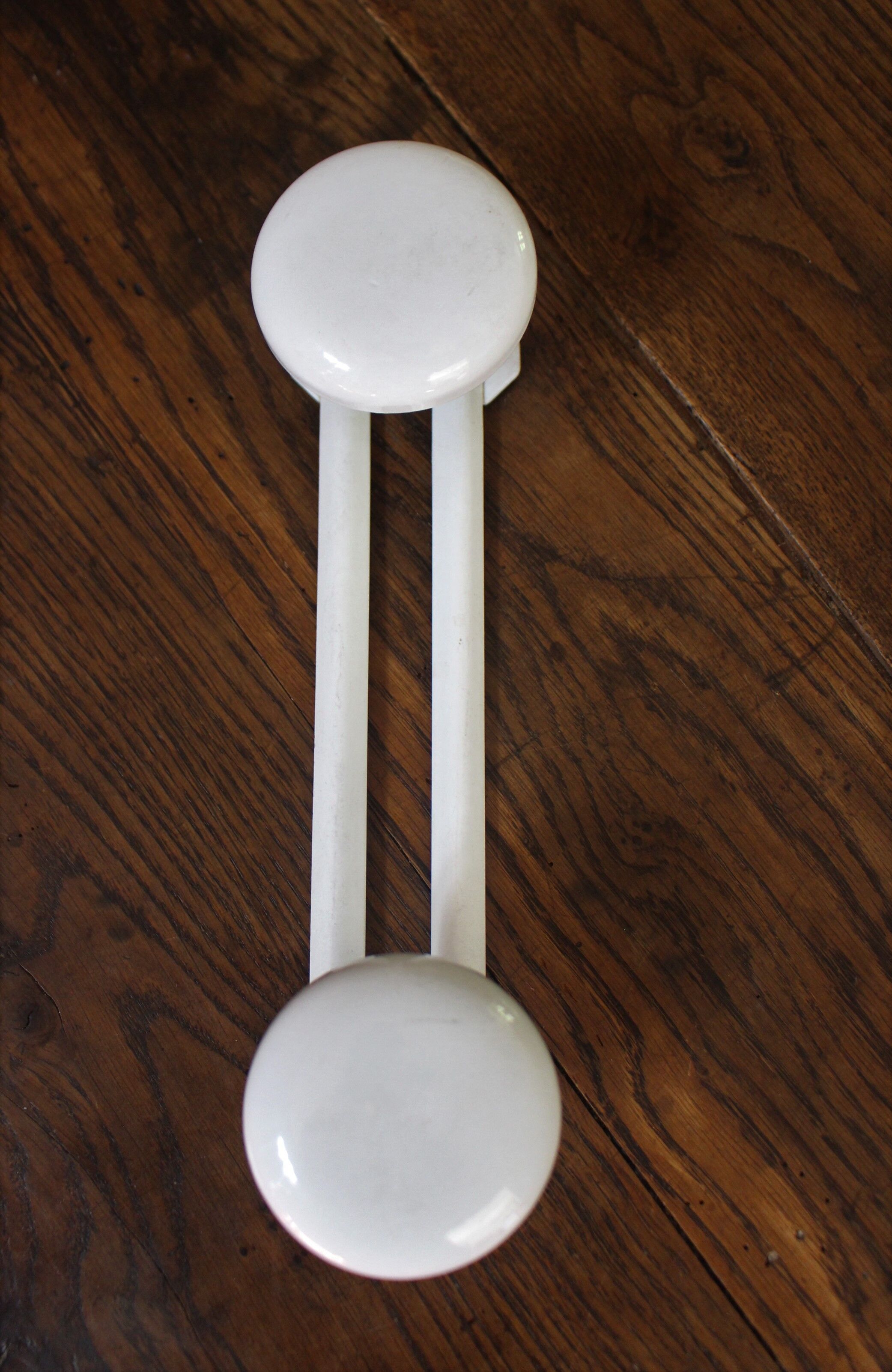 Vintage white metal coat rack with 2 hooks