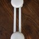Vintage white metal coat rack with 2 hooks