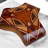 An Art Deco coffee table in multi-colored beech and rosewood.