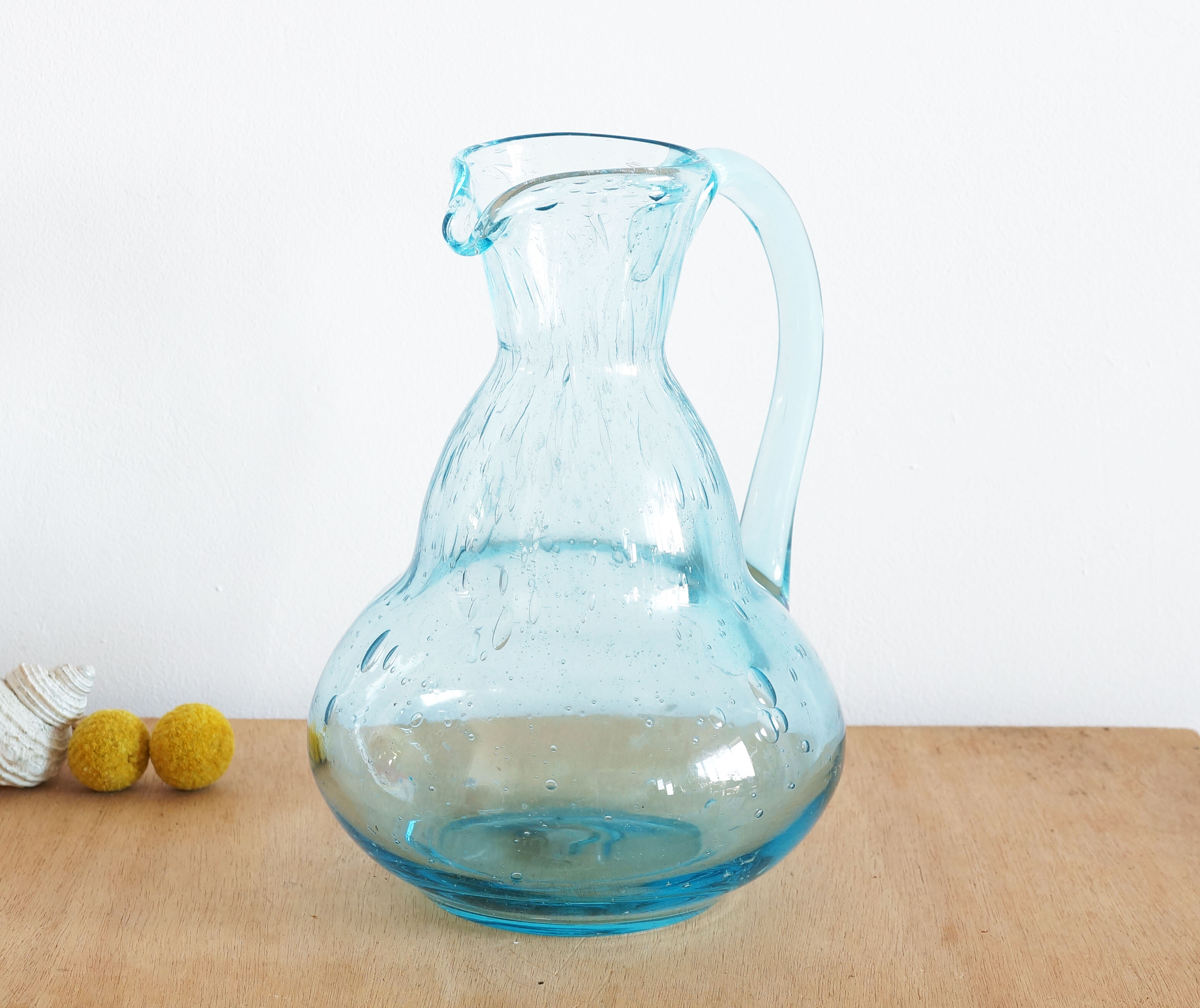 Blue carafe in bubble blown glass