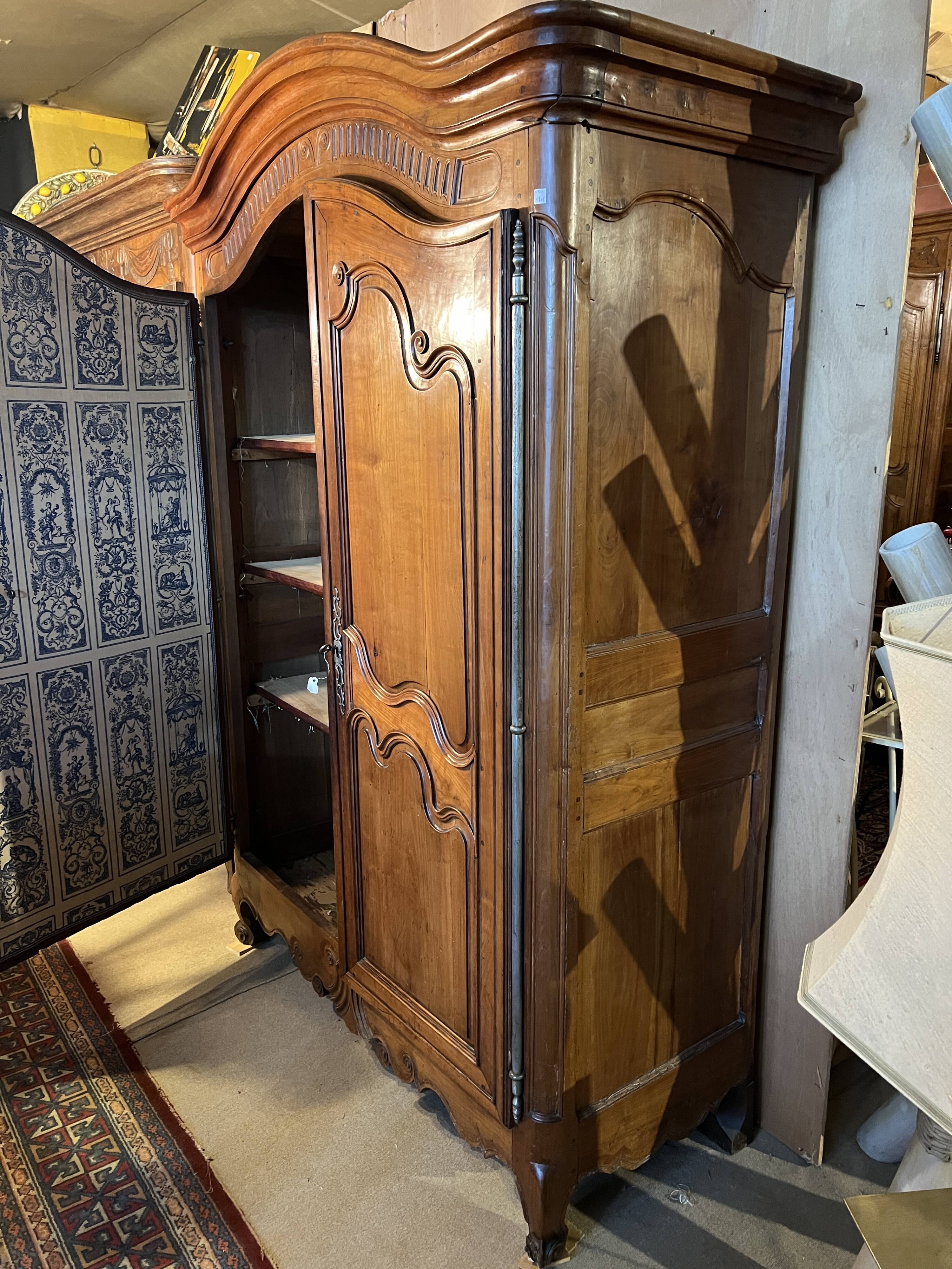 Louis XV wardrobe with two doors, Cherry wood. 18th century.
