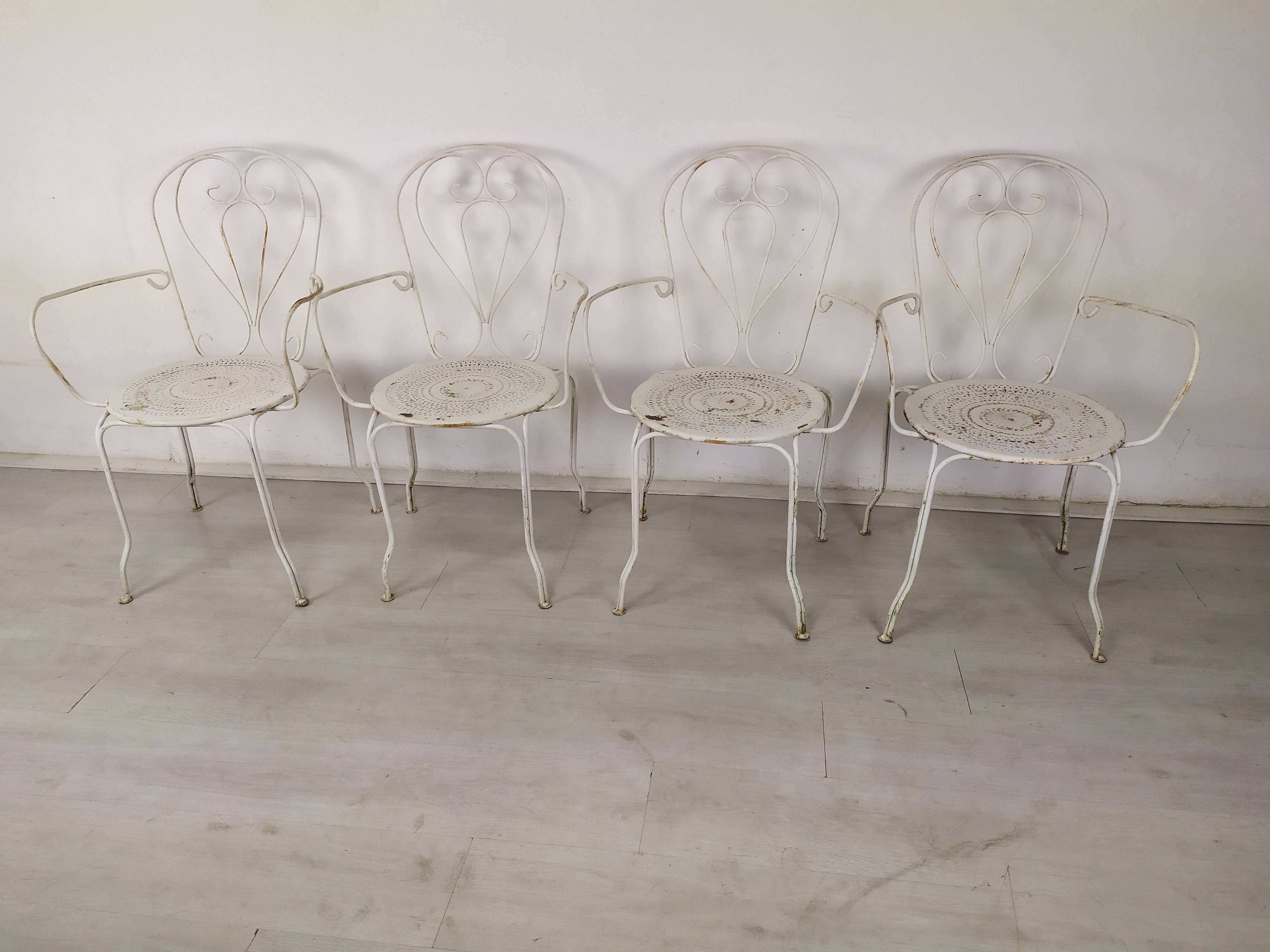 4 wrought iron garden armchairs