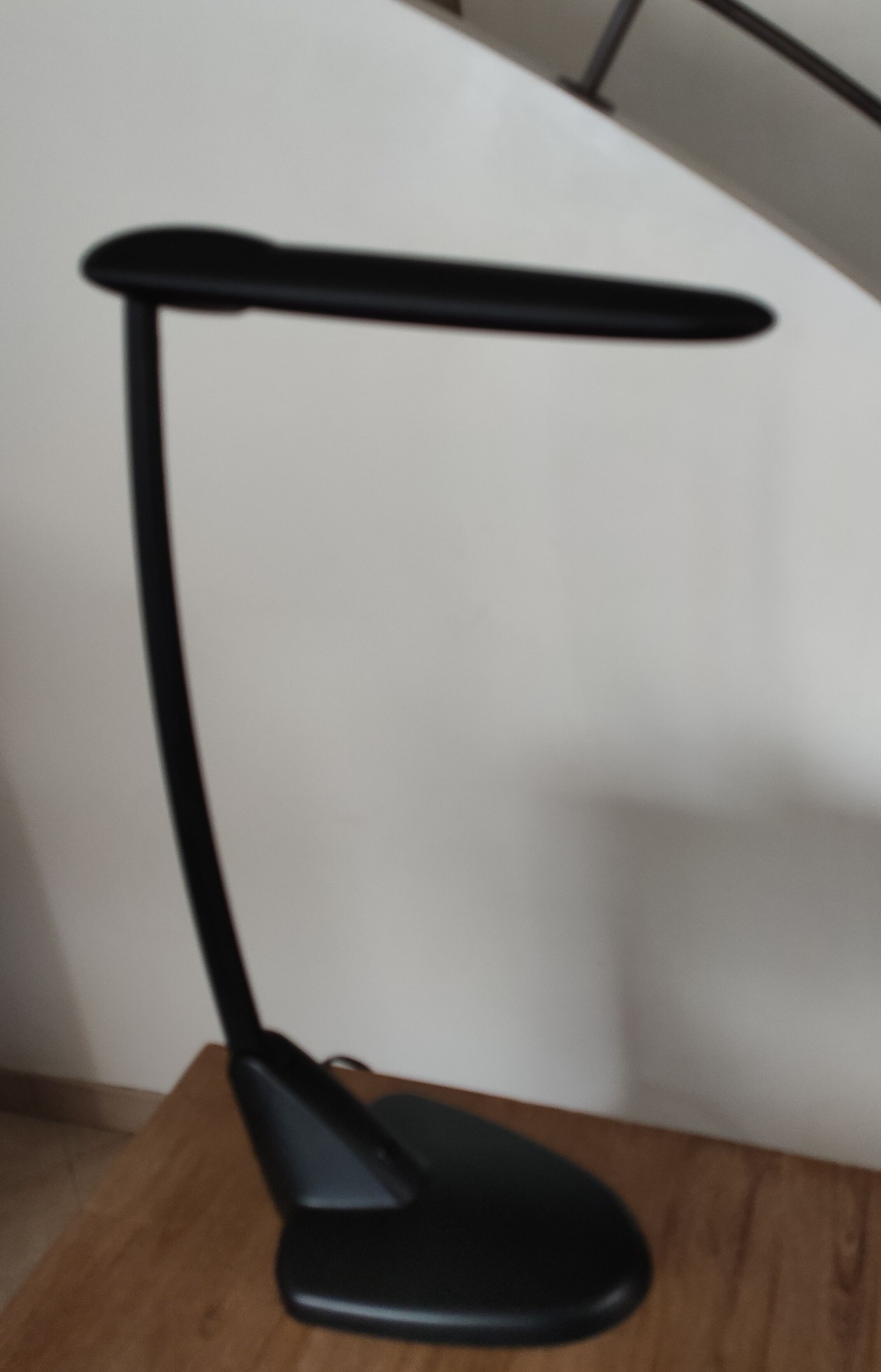 Black unilux workshop lamp with articulated arm