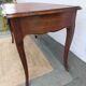 Louis XV style desk in wood, with a brown leather top.