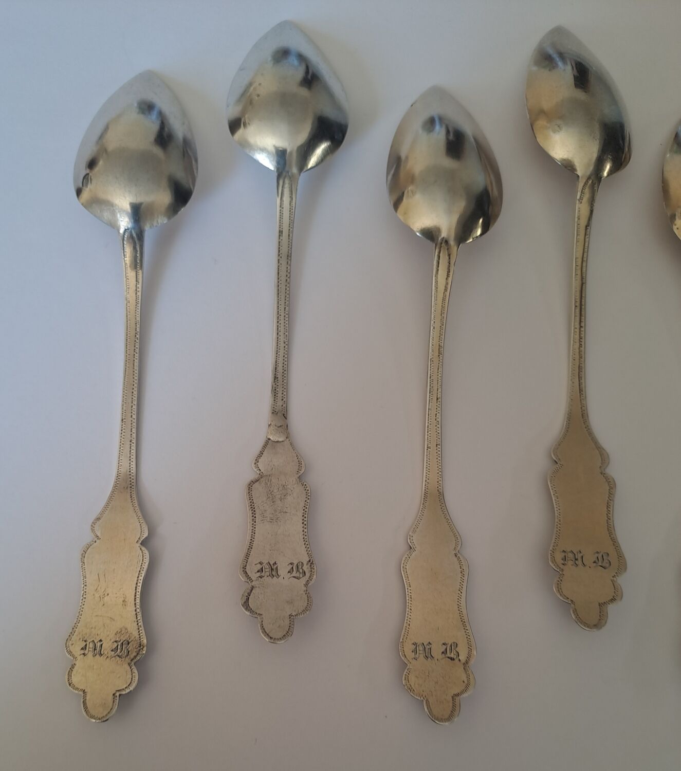 6 small numbered silver teaspoons, Minerva hallmark.