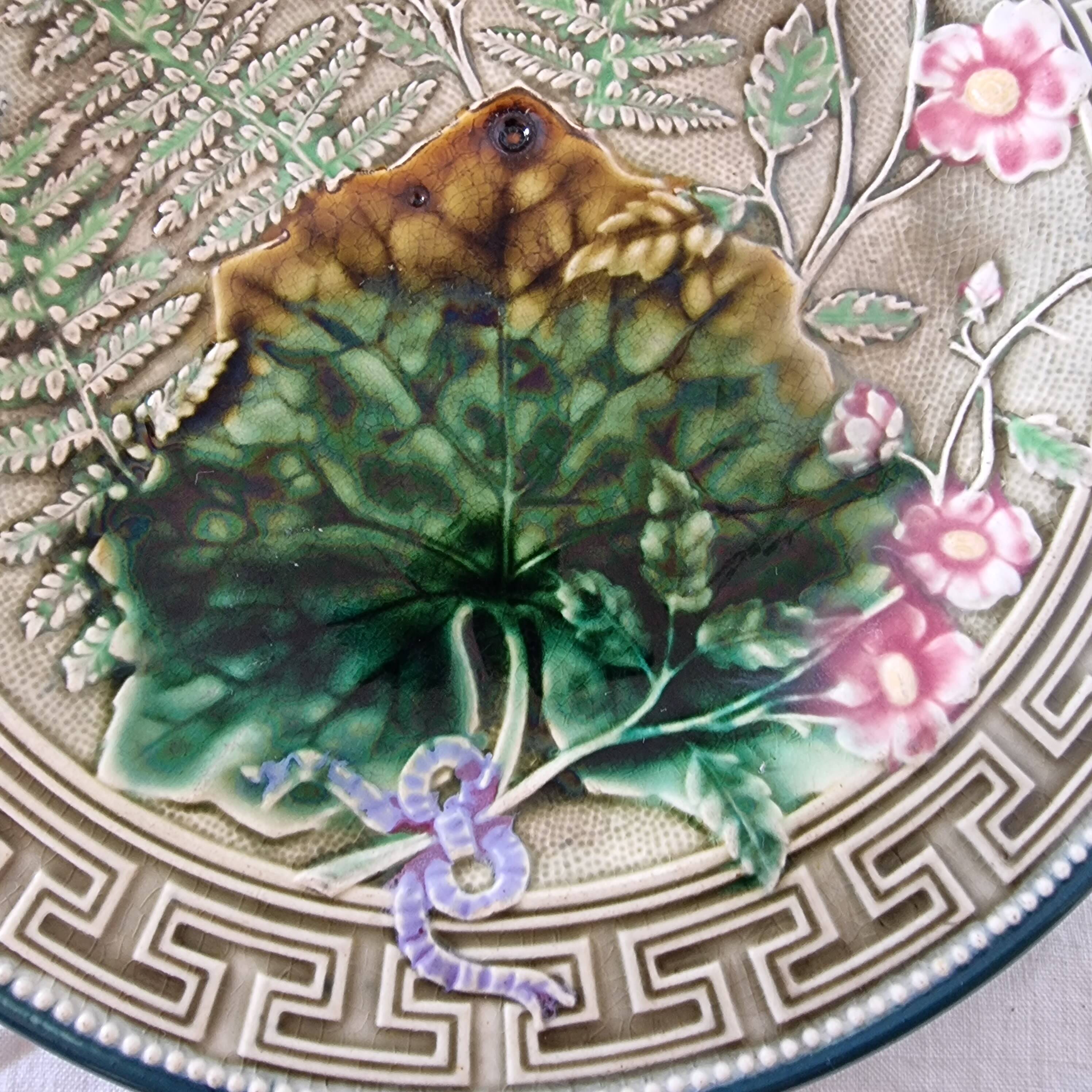Choisy Le Roi majolica or barbotine dish decorated with leaves and pink flowers from the 19th century