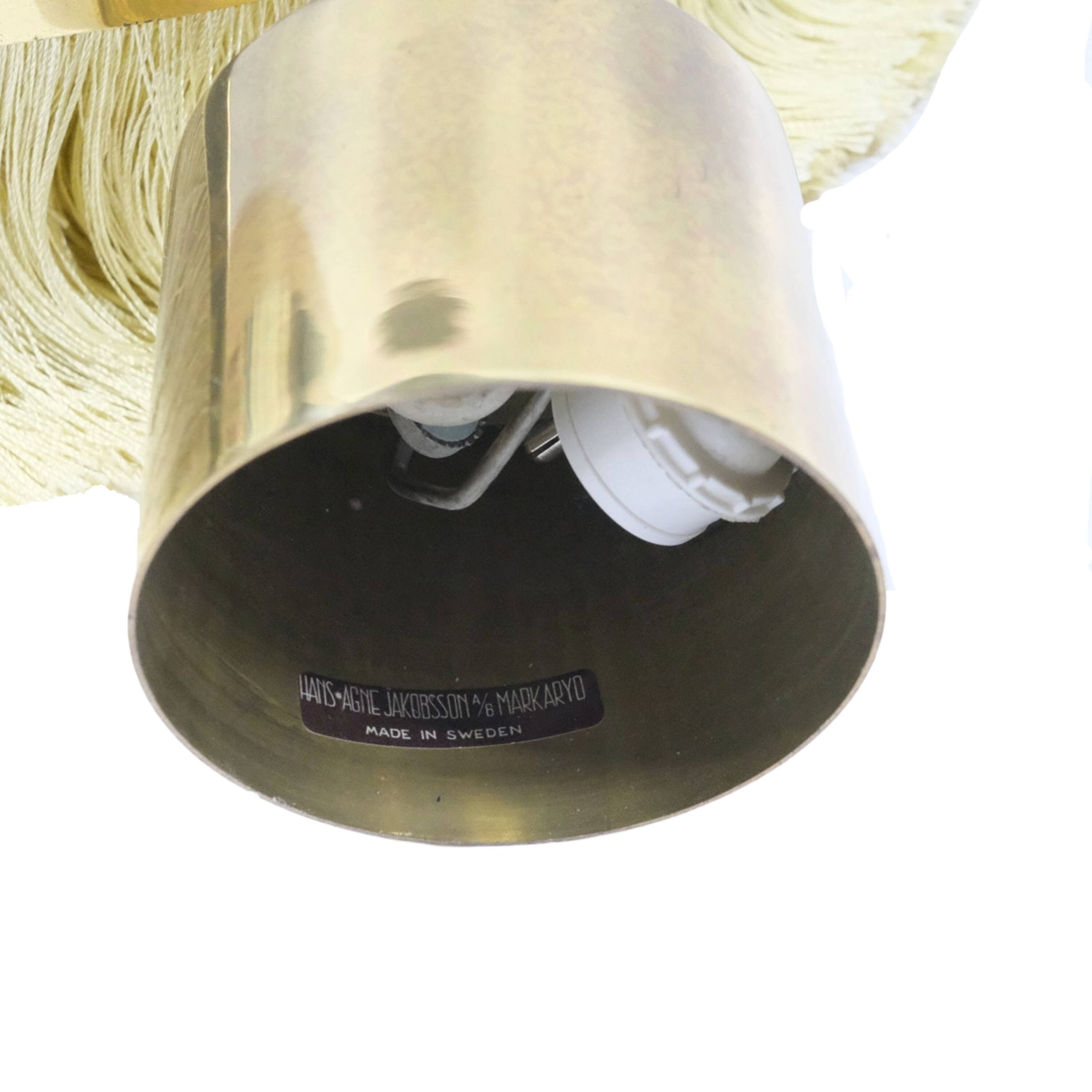 Hans-Agne Jakobsson T-603 pendant lamp in brass with yellow fringes.