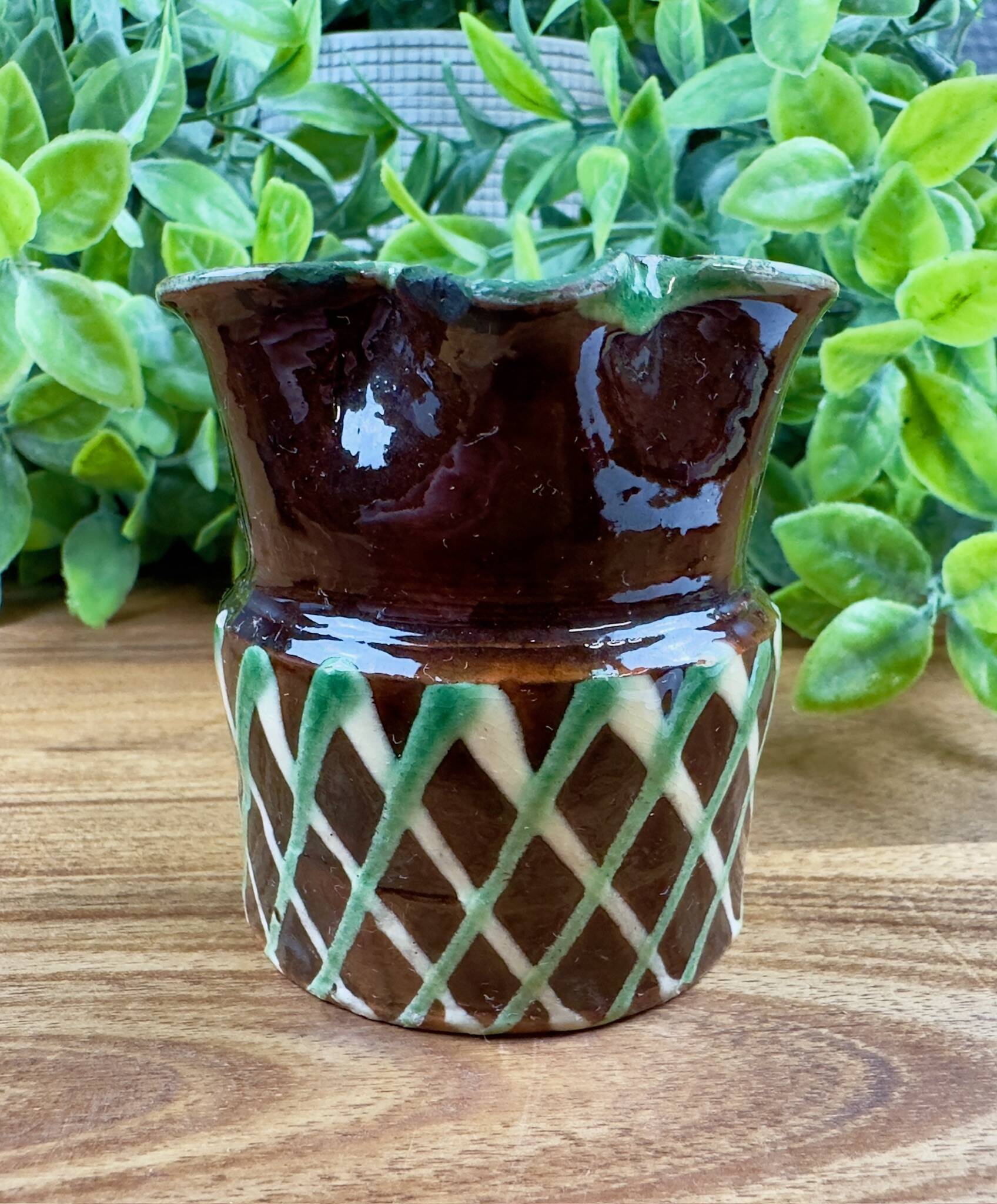 Small vintage ceramic jug in brown glazed with geometric design.