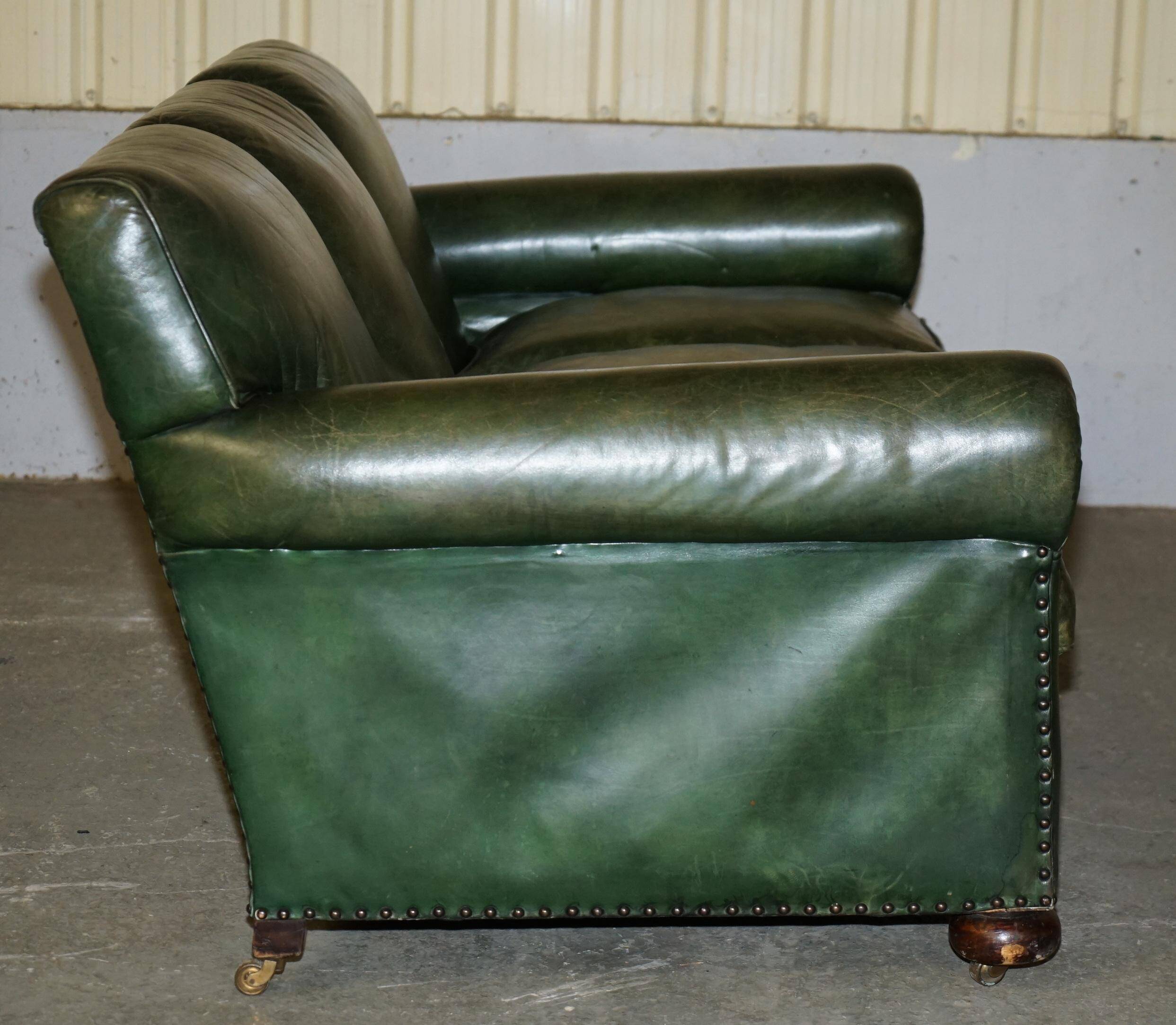 Victorian leather canapé, shield armrests, stamped Maple & Co.