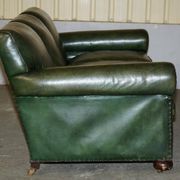 Victorian leather canapé, shield armrests, stamped Maple & Co.