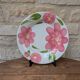 Round serving dish with hand-painted pink flowers in San Marciano ceramic.