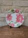 Round serving dish with hand-painted pink flowers in San Marciano ceramic.